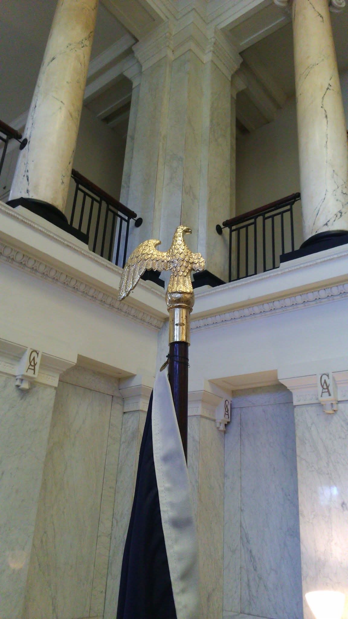 Eagle-topped flag in a US marble hall