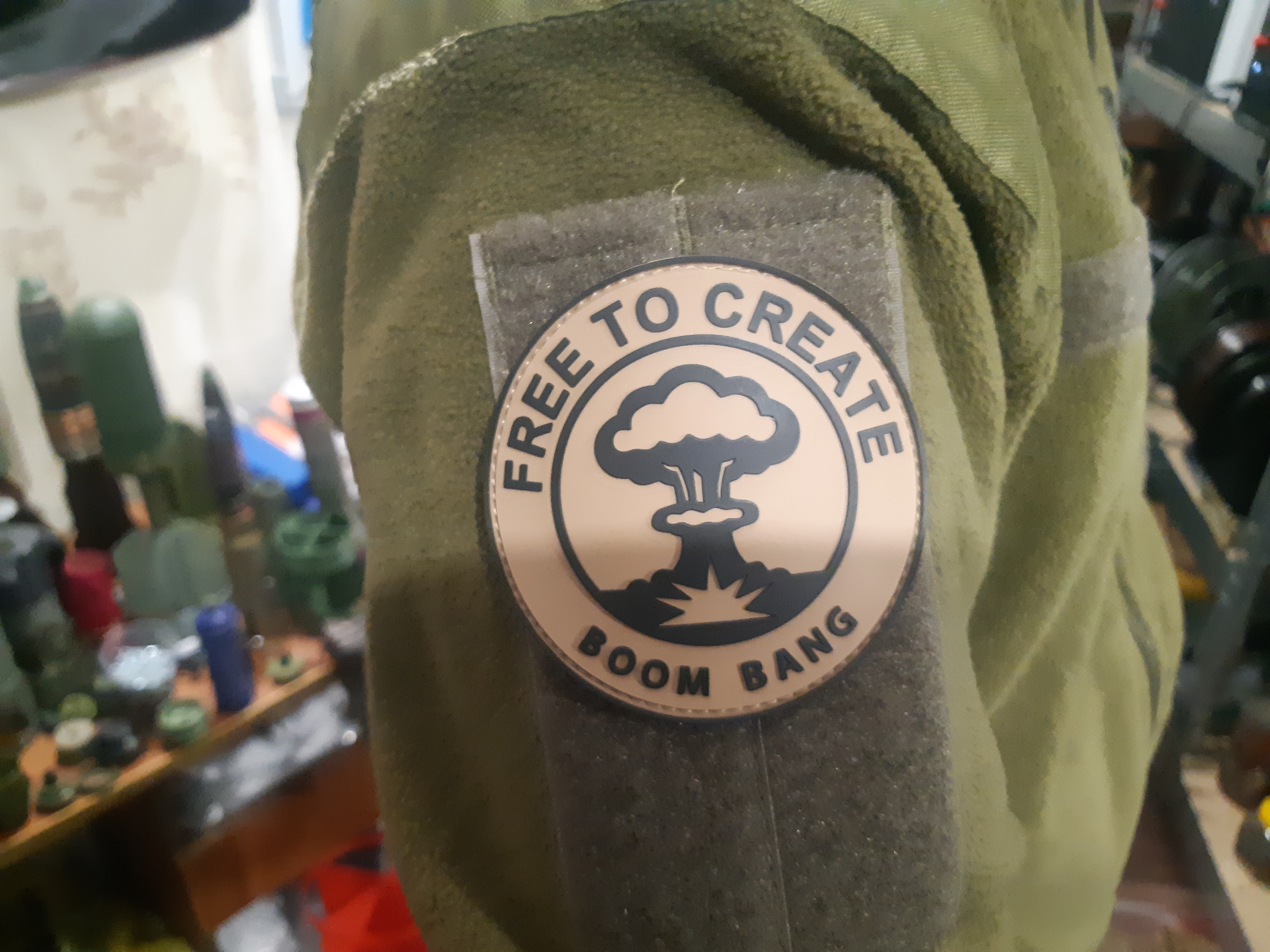 'Free to create — Boom Bang' patch on a soldier's sleeve